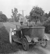 Postman delivering mail, rural mail route