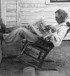 Farmer reading his farm paper